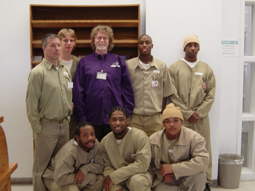 In 2014, SBB Founder Curt L. Tofteland assisted by three SBB senior mentors and one mentor worked with four 18-21 year-old inmates. As a culmination of their work, the ensemble shared monologues and a spoken word poem written by a senior mentor for an audience of staff and education inmates in the chapel.